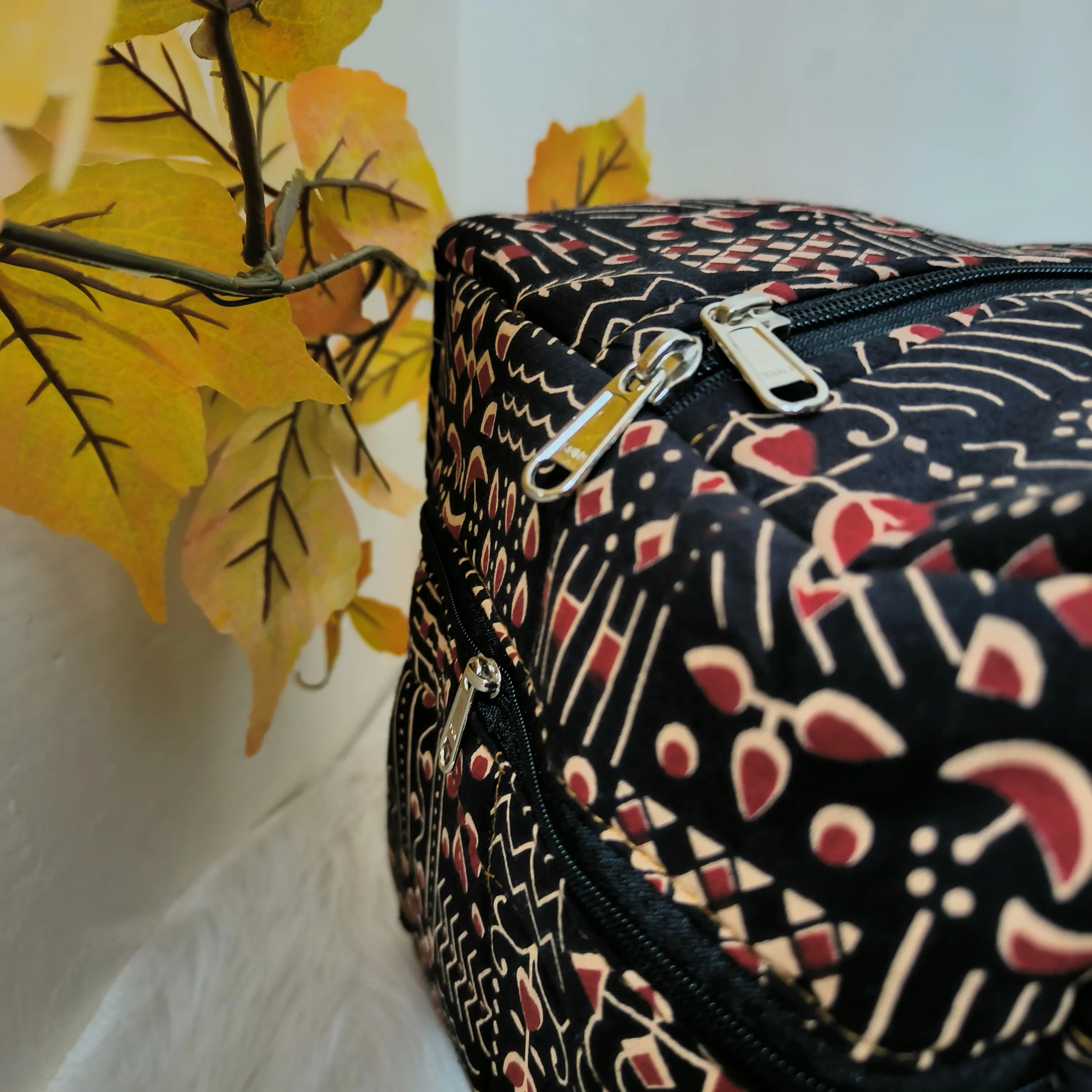 Rectangle Travel Bag Brown with Red Graphic Design.