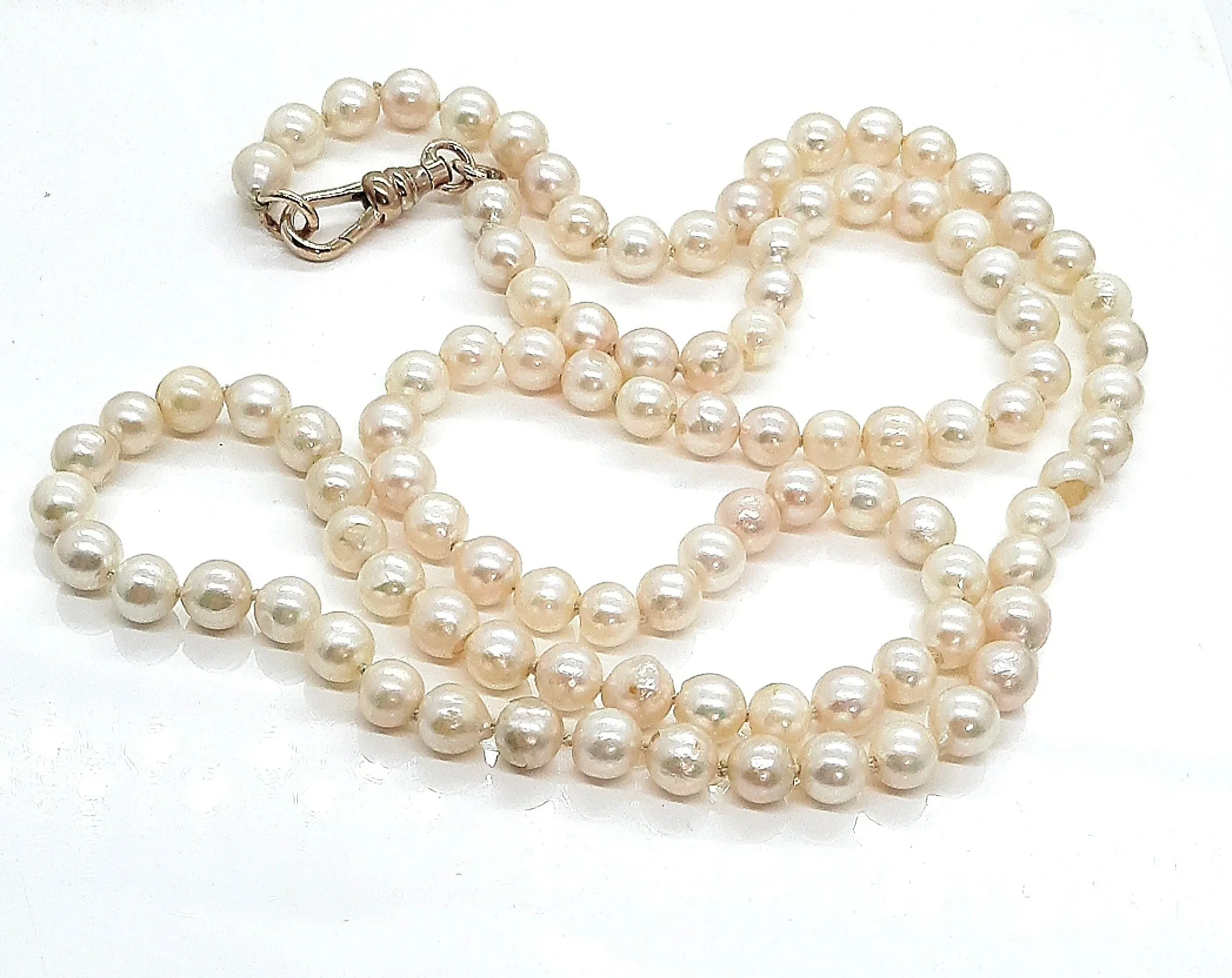 Strand of 99 Cultured Pearls with a Yellow Gold Albert Swivel Clasp