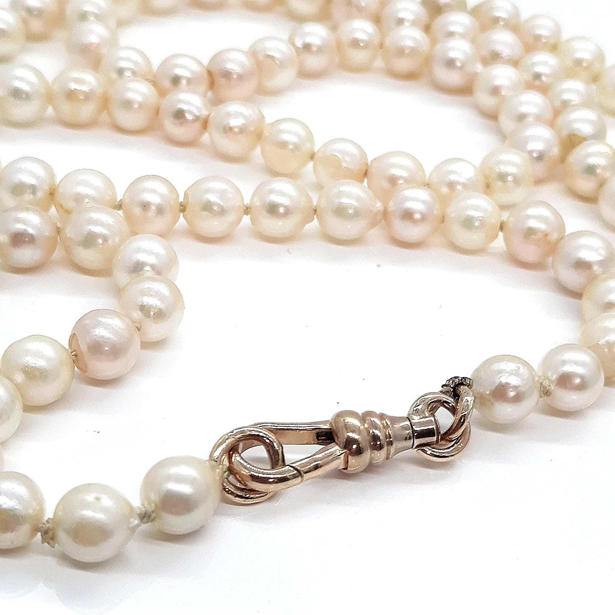 Strand of 99 Cultured Pearls with a Yellow Gold Albert Swivel Clasp