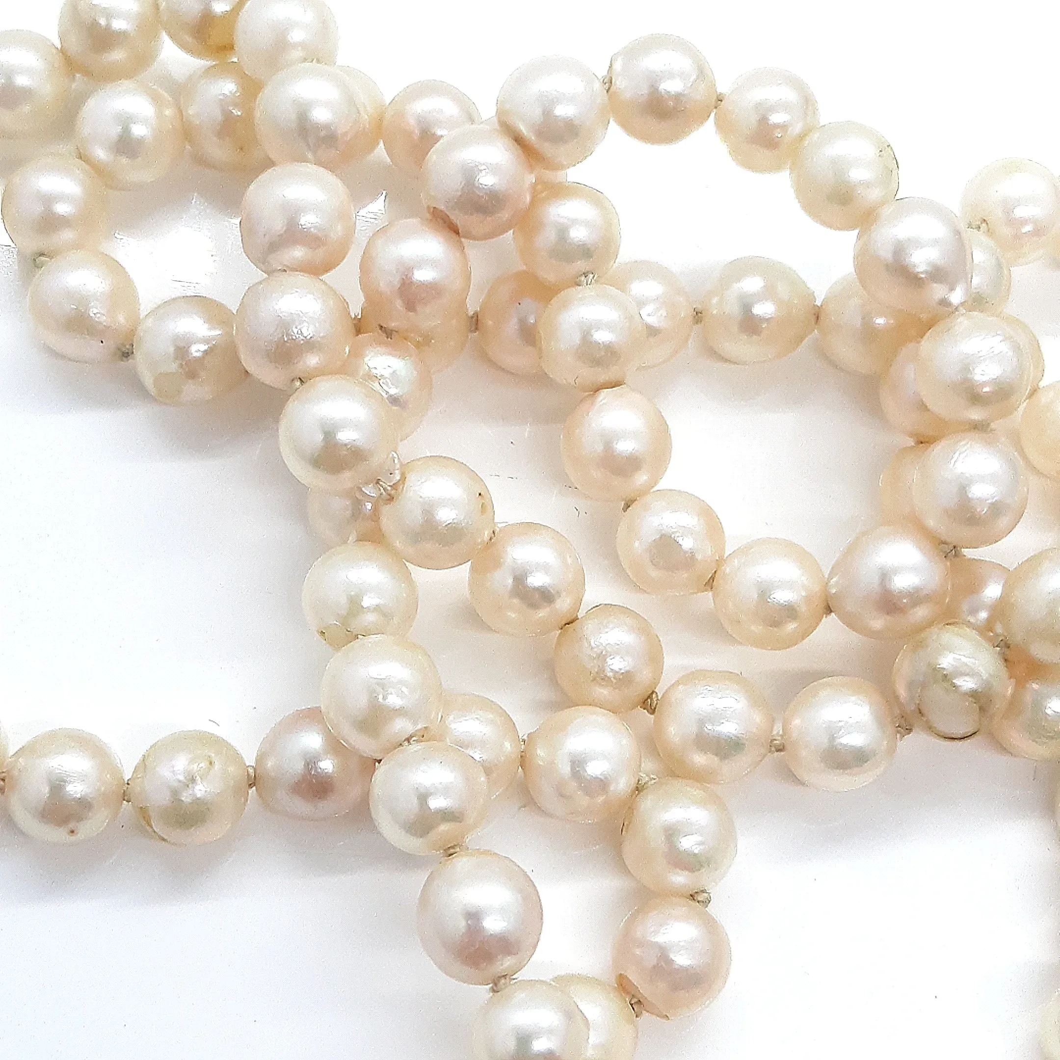 Strand of 99 Cultured Pearls with a Yellow Gold Albert Swivel Clasp
